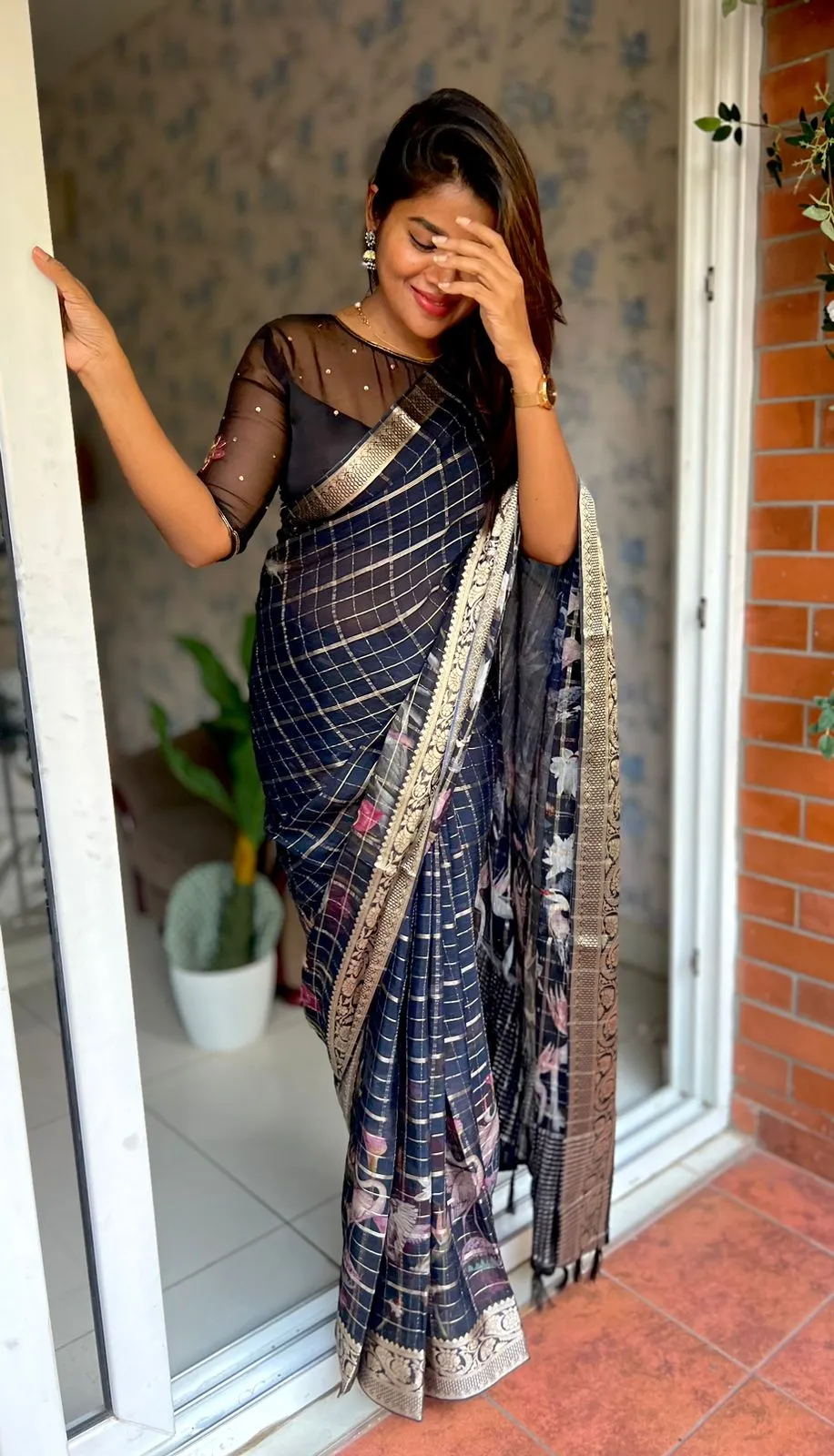 Black floral chiffon saree with black hand worked blouse